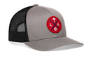 The Haka Hat Los Angeles Trucker Hat is a gray and black snapback featuring a red circular patch with a palm tree, baseball, and “L” & “A” separated by blue crossed lines. Brand: Haka Hat. Product: Red LA X Baseball Snapback.