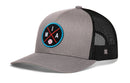 The Haka Hat Miami Trucker Hat | MIA X Baseball Snapback features a solid gray front, black mesh back, and a round patch with crossed bats, M I A letters, and a baseball—blending classic style with modern comfort.