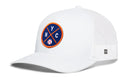The Haka Hat New York Trucker Hat is a white mesh snapback featuring a round blue NYC X baseball patch, comfort-fit sweatband, and side tag—combining sporty style with comfort.