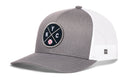 The Haka Hat New York Trucker Hat is a gray and white NYC x Baseball snapback with a black circular NYC patch and baseball graphic, plus a breathable white mesh back for comfort.
