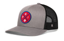 The Haka Hat Philadelphia Trucker Hat features a gray and black design with mesh back, a round red patch featuring PHI text and a baseball graphic—ideal for any Philadelphia fan. Brand: Haka Hat. Product: PHI X Baseball Snapback.