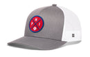 The Haka Hat Philadelphia Trucker Hat features a gray and white mesh design with a red and blue PHI x Baseball patch—perfect for fans seeking a classic Philadelphia hat style.