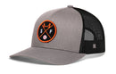 The Haka Hat San Francisco Trucker Hat is a gray and black SF X baseball snapback with a mesh back and round patch featuring orange trim, a bridge, crossed bats, S and F letters, and a baseball.