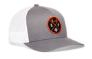 The Haka Hat San Francisco Trucker Hat is a gray and white mesh snapback with a round black and orange patch featuring a bridge, crossed bats, S and F letters, and a small baseball on the front. Brand: Haka Hat.