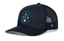 The Haka Hat Seattle Trucker Hat | SEA X Baseball Snapback by Haka Hat features a navy blue design with a mesh back and a round embroidered patch displaying crossed bats, the letters S, E, and A, and a baseball—an ideal choice for fans seeking a classic baseball snapback look.