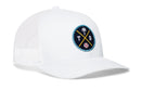 The Haka Hat Tampa Bay Trucker Hat is a white mesh snapback featuring a round patch with a palm tree, crossed bats, a baseball, and the letters T and B on the front.