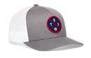 The Haka Hat Texas Trucker Hat features a gray and white mesh design, round navy patch with red and white TEX lettering, a small baseball graphic, and classic snapback style for the perfect fit.