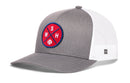 The Haka Hat Washington DC Trucker Hat features a gray and white design with a mesh back, red circular patch on the front with blue lines, WSH letters, and a small baseball icon.
