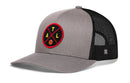 The Haka Hat Atlanta Trucker Hat | ATL X Basketball Snapback features a gray and black mesh design with a round ATL patch and basketball graphic, plus a small side logo for classic Haka Hat style.