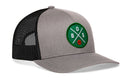 The Haka Hat Boston Trucker Hat is a gray and black snapback featuring a green patch with crossed lines, "BOS," and a basketball graphic on the front.