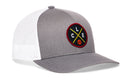 The Haka Hat Cleveland Trucker Hat, a snapback by Haka Hat, features a gray and white design with a round black patch showing yellow and red crossed lines, "CLE" letters, and a red basketball at the bottom.