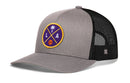 The Haka Hat Los Angeles Trucker Hat is a gray and black snapback with a mesh back and front round patch showing a palm tree, basketball, and purple and gold LA letters.