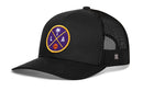The Haka Hat Los Angeles Trucker Hat | LA X Basketball Snapback by Haka Hat is a black mesh trucker hat with a curved brim, snapback closure, and a purple, gold, and orange LA X embroidered patch featuring basketball and palm tree details.