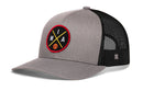 The Haka Hat Miami Trucker Hat | MIA X Basketball Snapback features a gray and black mesh design, round front patch with crossed yellow lines, "MIA" letters, orange basketball detail, and classic HAKA 5.0 snapback closure for adjustable fit.
