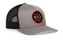 The Haka Hat Miami Trucker Hat (MIA X Basketball Snapback) is gray and black with mesh panels, a round patch on the front featuring "MIA," crossed yellow lines, and a small orange basketball.
