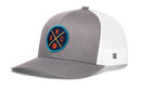 The Haka Hat Oklahoma City Trucker Hat features gray and white mesh, a blue round patch with yellow crossed lines, "OKC" lettering, and a basketball icon. Also known as the OKC X Basketball Snapback by Haka Hat.