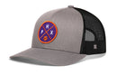 The Haka Hat Phoenix Trucker Hat features a gray front, black mesh back, and an orange, purple, and white PHX basketball patch. This PHX X Basketball Snapback blends sporty style and classic comfort.