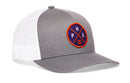 The Haka Hat Phoenix Trucker Hat features gray and white mesh, a circular purple patch with an orange border, "PHX," and a basketball graphic. Branded as the PHX X Basketball Snapback by Haka Hat.