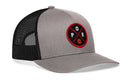 The Haka Hat Portland Trucker Hat (POR X Basketball Snapback) features gray and black mesh, a classic snapback style, and a red and black circular patch with "P O R" and a basketball graphic on the front.