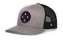 The Haka Hat Sacramento Trucker Hat is a gray and black snapback with mesh panels, featuring a front patch showing the letters S, A, C and a small basketball in a crossed design for classic comfort.