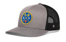 The Haka Hat San Francisco Trucker Hat | GS X Basketball Snapback features a gray and black design with a blue and yellow patch of a bridge, basketball, and the letters G and S. It has a black mesh back and adjustable snapback closure.