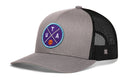 The Haka Hat Utah Trucker Hat | UTA X Basketball Snapback features gray and black mesh with a round purple, blue, and teal patch showing "UTA" and a basketball—ideal for Salt Lake City fans seeking a signature look.