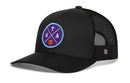 The Haka Hat Utah Trucker Hat is a black mesh snapback featuring a circular purple and blue patch with "UTA," a small basketball icon, and crossed lines on the front.