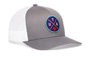 The Haka Hat Utah Trucker Hat is a gray and white snapback featuring a circular patch with crossed blue lines, the letters UTA, and a small orange basketball on a purple background.