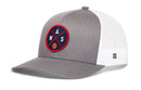 The Haka Hat Washington DC Trucker Hat features a gray and white design, mesh back, and a round front patch with crossed lines, "WAS," and a basketball icon. Brand: Haka Hat.