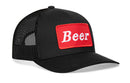 The Haka Hat Beer Trucker Hat is a premium black snapback with mesh back, curved bill, and a bold red "Beer" patch—an essential Haka Hat accessory for any collection.