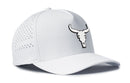 The Haka Hat Bull Skull Performance 5-Panel Hat features a white bull skull logo with black outline, side ventilation holes, and a comfy Flexfit sweatband for all-day wear—Steer Flexfit Snapback by Haka Hat.