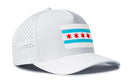 The Haka Hat Chicago Flag Performance 5-Panel Hat by Haka Hat features a patch of the Chicago flag with four red stars and two blue stripes, plus a Flexfit® sweatband for comfort.