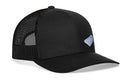 The Haka Hat Cornhole Board Trucker Hat in Black Bags features a snapback closure, mesh back, curved bill, and a small light blue embroidered patch for classic cornhole style.