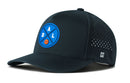 The Haka Hat Dallas Basketball Performance 5-Panel Hat features a black design with a blue circular DAL basketball logo, side ventilation holes, Flexfit® snapback comfort, and a small H logo near the brim.