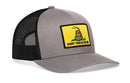 The Haka Hat Dont Tread On Me Trucker Hat is a gray and black snapback featuring a yellow patch with a coiled rattlesnake and DONT TREAD ON ME, inspired by the Gadsden Flag.