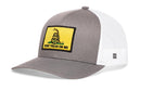 The Haka Hat Dont Tread On Me Trucker Hat features a gray and white design, a yellow Gadsden Flag patch with a coiled rattlesnake and “DONT TREAD ON ME,” plus mesh back and curved brim in classic snapback style.