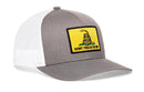 The Haka Hat Dont Tread On Me Trucker Hat is a gray and white snapback featuring a yellow Gadsden Flag patch with a coiled rattlesnake and bold lettering, inspired by the classic design.