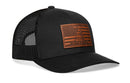 The Haka Hat Dont Tread on Me American Flag Trucker Hat is a black mesh snapback by Haka Hat with a stitched brown Gadsden leather patch featuring an American flag and coiled snake.