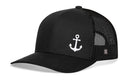 The Haka Hat Anchor Trucker Hat is a black boating snapback featuring a white embroidered anchor on the front panel, shown against a white background.