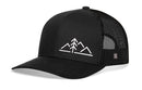 The Haka Hat Mountains with Pine Tree Trucker Hat by Haka Hat is a black mesh outdoors snapback featuring a white minimalist mountain and pine tree design on the front panel.