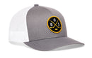 Here’s a rewritten version of the sentence using your product data: The Haka Hat Boston Hockey Trucker Hat | BOS X Snapback by Haka Hat features a solid gray front panel with white mesh backing, finished in authentic trucker hat styling. A distinctive round black and yellow patch on the front displays crossed hockey sticks, a puck, and the letters “BOS” for Boston hockey fans.