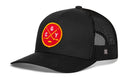 Black Haka Hat Calgary Hockey Trucker Hat with a mesh back and a red circular patch on the front featuring crossed hockey sticks, a puck, and the letters C, G, and Y.