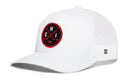 The Haka Hat Chicago Hockey Trucker Hat | CHI X Snapback by Haka Hat is a white mesh trucker hat featuring a round black and red embroidered patch on the front with two crossed hockey sticks, the letters CHI, and a small hockey puck—a signature 5.0 trucker style that combines sporty spirit with classic design.
