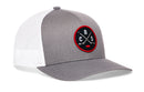 Introducing the Haka Hat Columbus Hockey Trucker Hat | CBS X Snapback by Haka Hat. This gray and white snapback features a round black and red CBS X embroidered patch on the front, showcasing crossed hockey sticks and the letters C, B, and S—perfect for Columbus hockey fans. The hat is finished with a white mesh back for classic trucker style.