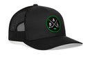 The Haka Hat Dallas Hockey Trucker Hat | DAL X Snapback features a black design with a breathable mesh back and a circular green and black patch on the front, embroidered with crossed hockey sticks and the letters D, A, and L—making it the perfect snapback hat for Dallas hockey fans.