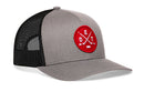 Gray and black Haka Hat Detroit Hockey Trucker Hat featuring a red circular patch with crossed hockey sticks, a puck, and the letters D, E, and T.