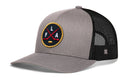Grey Haka Hat Florida Hockey Trucker Hat with a black mesh back and a circular patch featuring crossed hockey sticks, a puck, and the letters FLA.