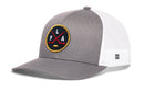 Gray and white Haka Hat Florida Hockey Trucker Hat featuring a circular FLA X patch with crossed hockey sticks and a hockey puck.