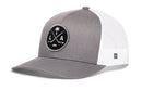 Grey and white Haka Hat Los Angeles Hockey Trucker Hat | LA X Snapback featuring a circular patch with a palm tree, crossed hockey sticks, and the letters L and A.
