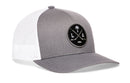 Grey and white Haka Hat Los Angeles Hockey Trucker Hat featuring a circular LA X patch with crossed hockey sticks and a palm tree.